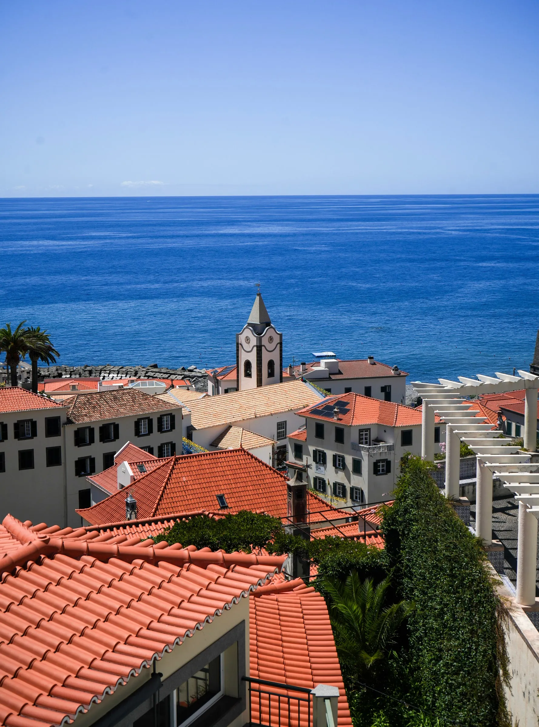 Ponta do Sol rooftops, church and Atlantic Ocean seen from the house balcony