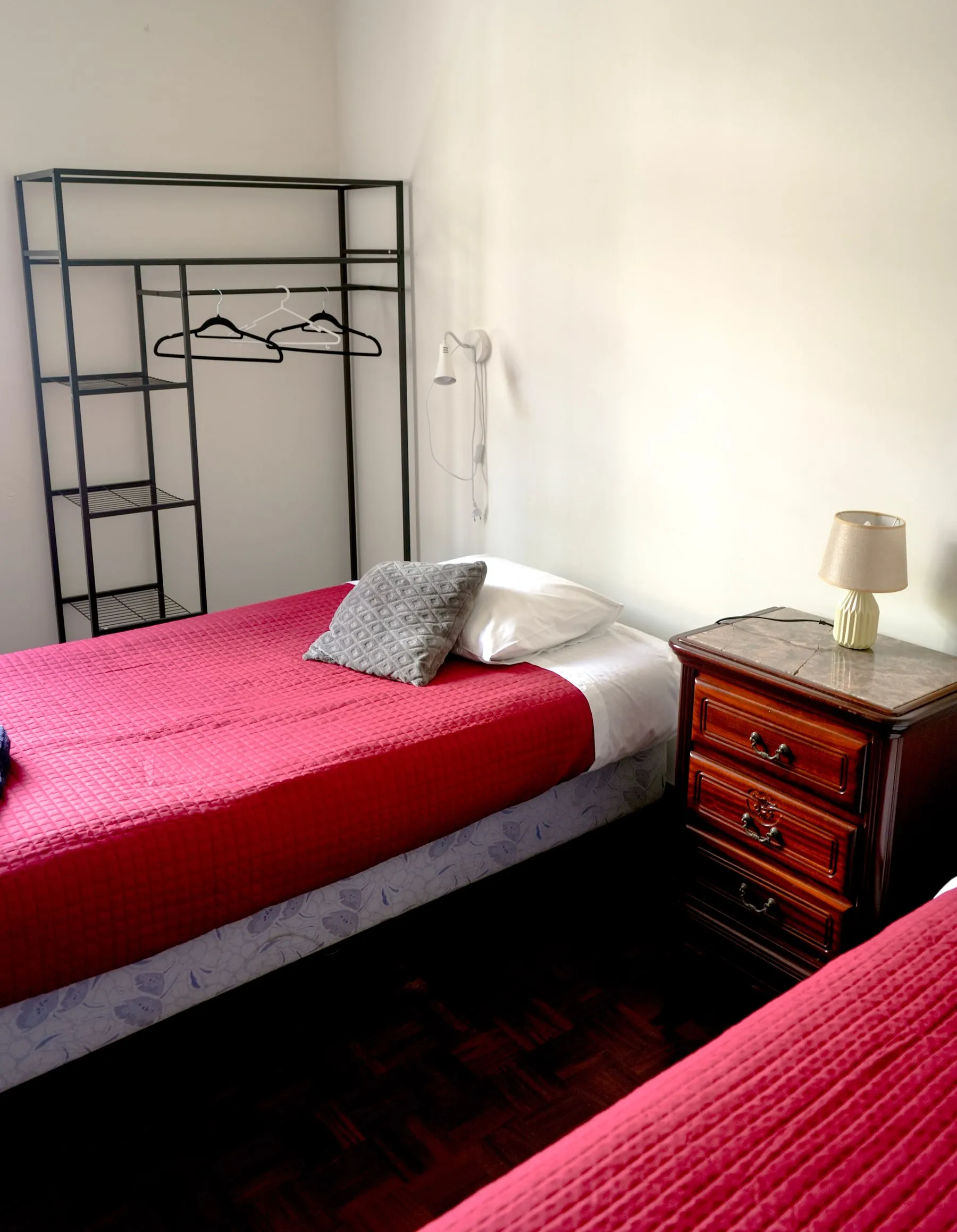 Penne bed, bedside table and open clothes rail