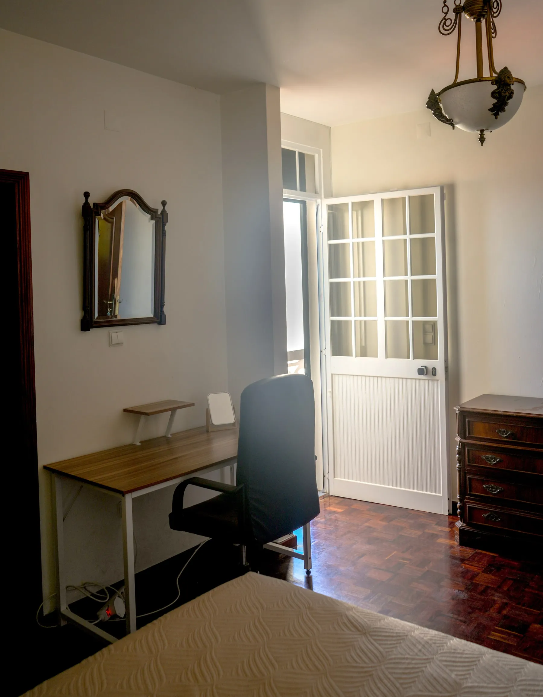 Rigatoni desk and chair beside the open balcony door