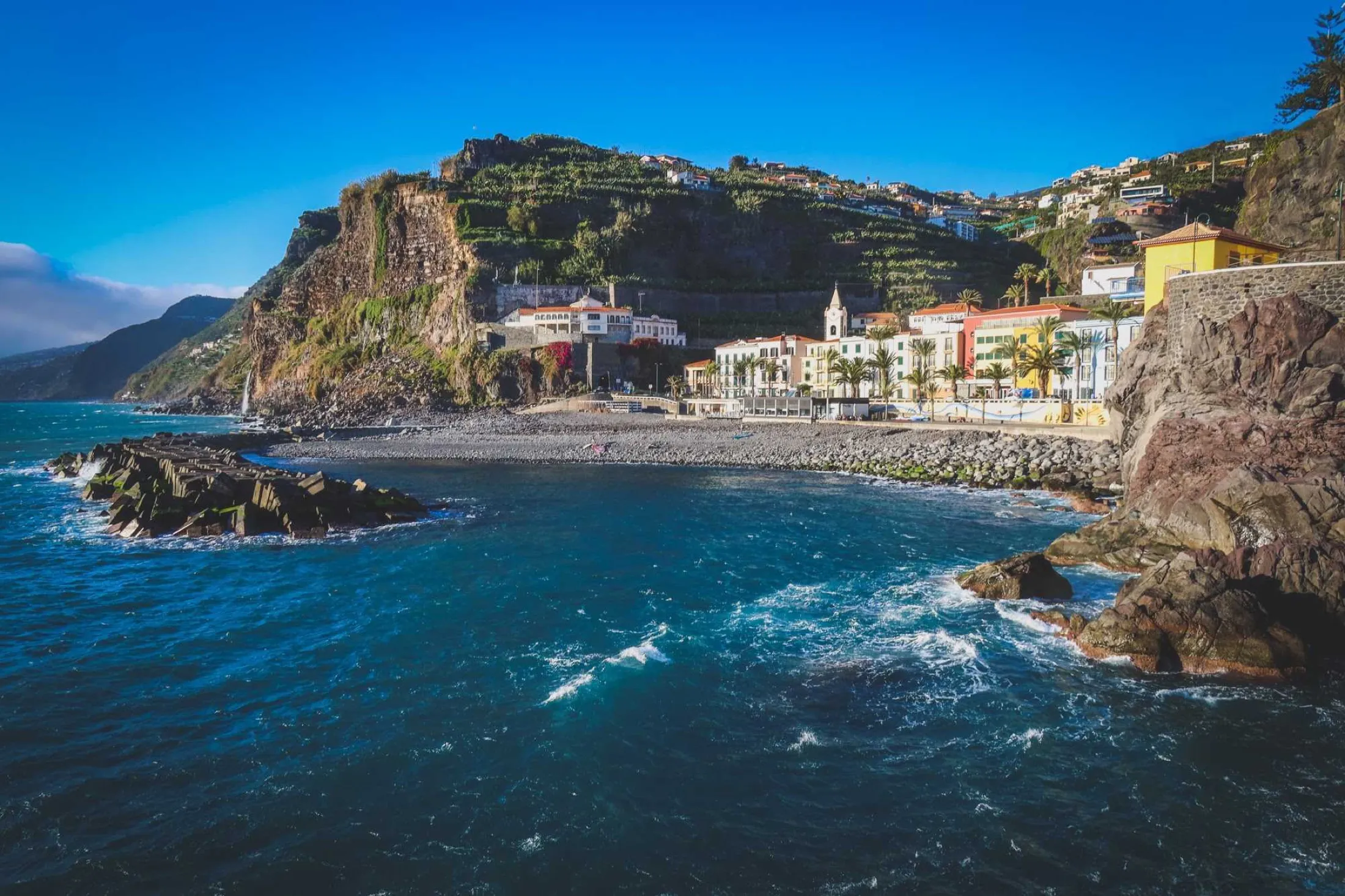 Sun and cloud sharing the sky above Ponta do Sol bay in Madeira